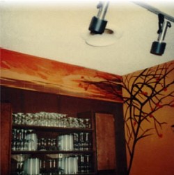 A mural on a mirror wall in the club of a restaurant, with the following walls to match.